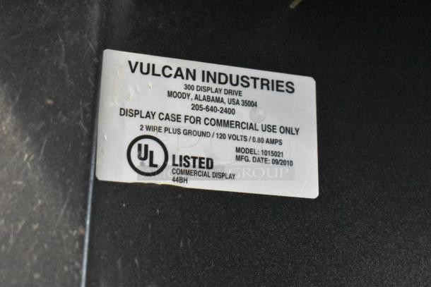 Vulcan 1015021 metal bakery display case on casters, 125V, commercial use. UL listed, label shows specs and model.