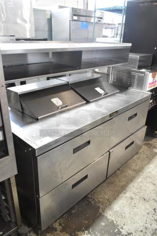 Delfield UCD4464N-12-DD5 stainless steel prep table with 4 drawers, over shelf, on casters; 115V, 1 phase, excellent condition.