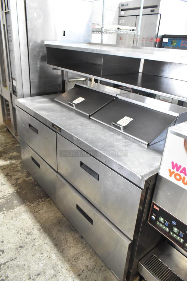 Delfield UCD4464N-12-DD5 stainless steel prep table, 4 drawers, over shelf, 115V, commercial casters, excellent condition.