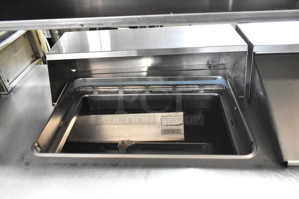 Delfield UCD4464N-12-DD5 stainless steel prep table, bain marie top, 4 drawers, over shelf, commercial casters, 115V.