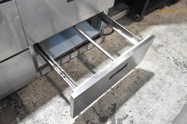 Delfield Stainless Steel Prep Table, Model UCD4464N-12-DD5, with 4 drawers, over shelf, and commercial casters. 115V, 1 phase.