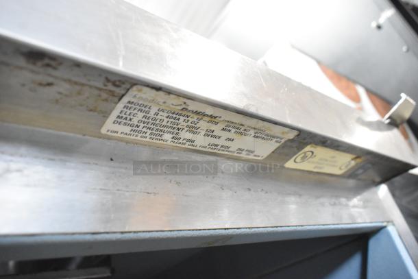 Delfield UCD4464N-12-DD5 stainless steel prep table label, showing model and electrical specs; used condition.