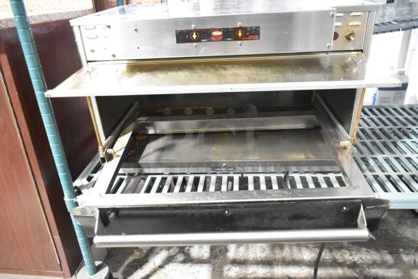 Hatco Glo Ray stainless steel heated warming case, commercial use, 120 volts, 1 phase, visible wear and Caution: Hot label.
