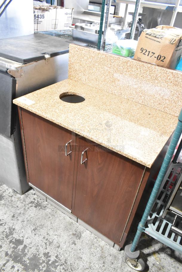 Wood pattern trash can shell with trash deposit hole and two doors, featuring metal handles. Good condition.
