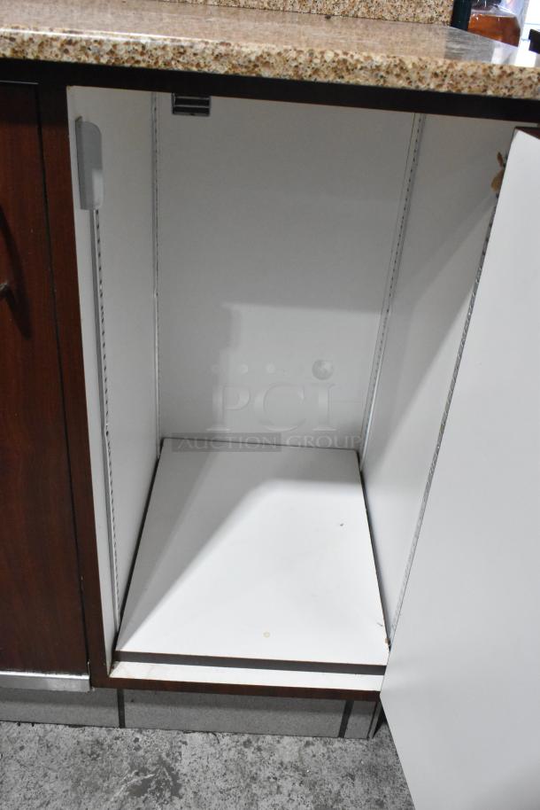 Wood pattern trash can shell featuring trash deposit hole and two doors. Inside view shows spacious interior and white finish.