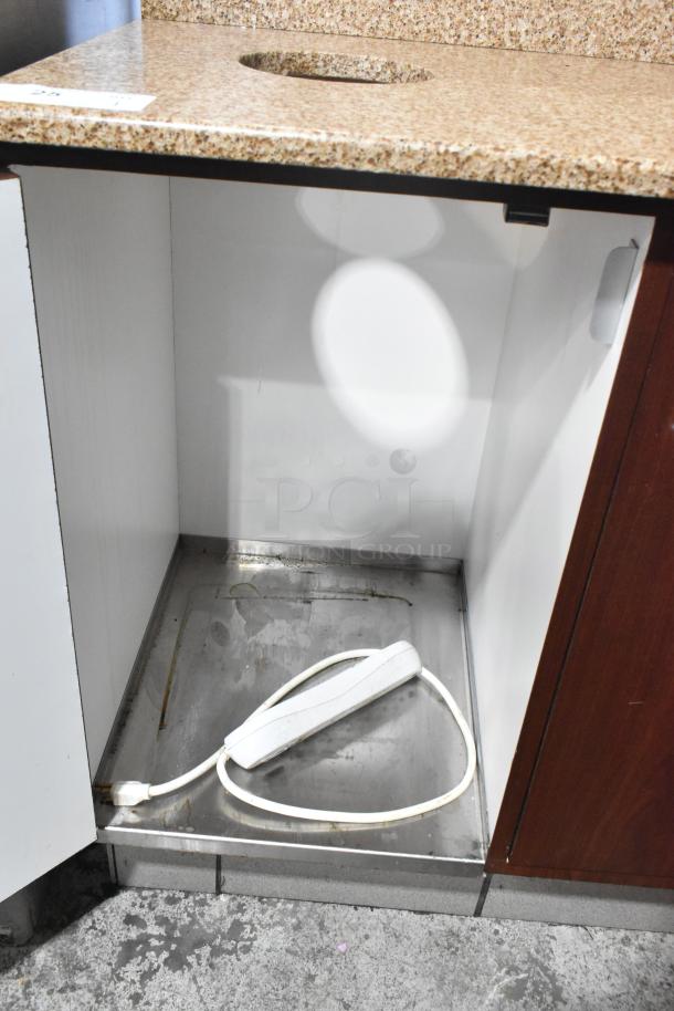 Wood-pattern trash can shell with granite-style top, featuring a trash deposit hole and two doors. Inner compartment visible.