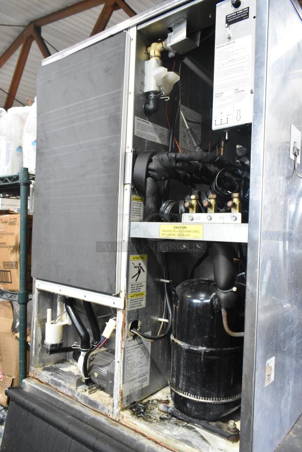 Hoshizaki KM-1340MRH stainless steel commercial ice head on bin, showing internal components; 208-230V, 1 phase.