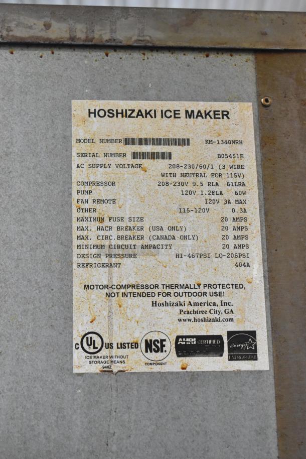 Hoshizaki KM-1340MRH stainless steel commercial ice maker head on ice bin, 208-230V, 1 phase, label with model and specs.