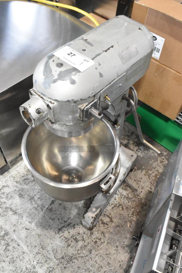 Hobart A 200 commercial 20 qt planetary dough mixer with metal bowl. 115V, 1 phase. Visible wear, ID tag on top.
