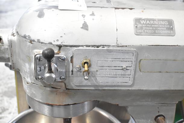 Hobart A 200 commercial countertop dough mixer with metal mixing bowl. Shows surface wear and warning label. 115V, 1 Phase.