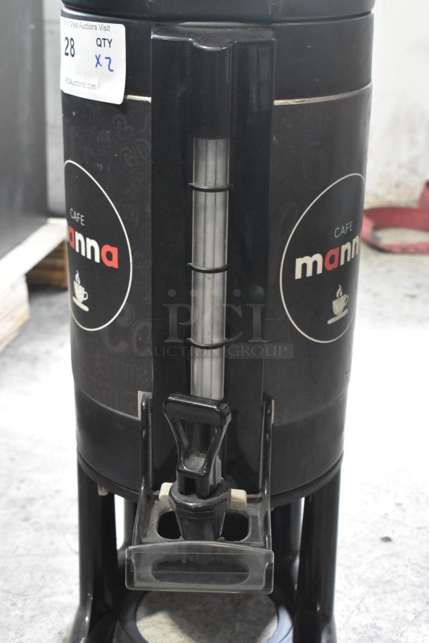 Cafe Manna satellite server with dispenser tap; black finish with branding. Auction tag indicates lot quantity of two.