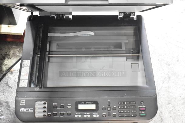 Brother MFC-L2700DW multifunction printer in used condition. Features scanner, copier, and fax. Model label visible.