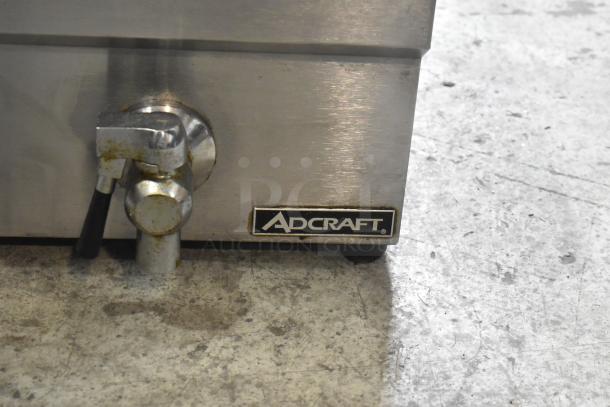 Adcraft DF-12L stainless steel deep fat fryer with metal fry basket, lid, and 208/240V power. Adcraft branding visible.