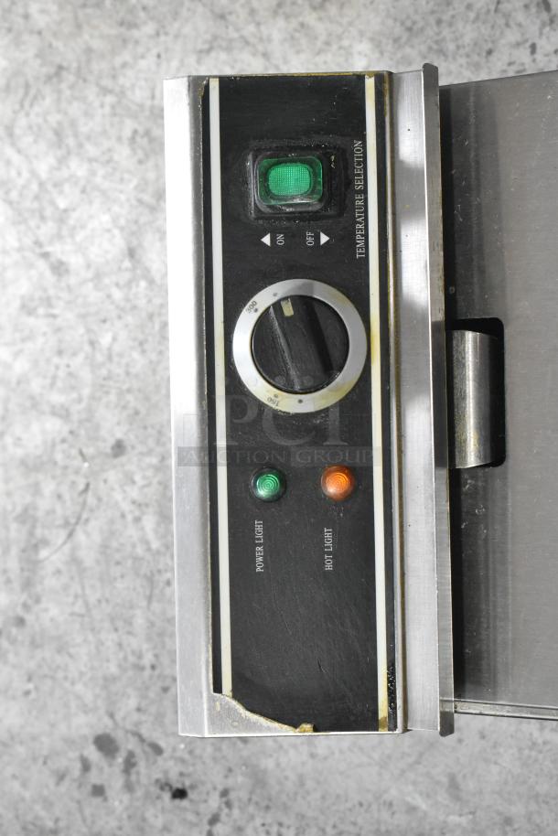 Adcraft DF-12L fryer control panel; features temperature dial, power light, and hot light. Good condition, minor wear.