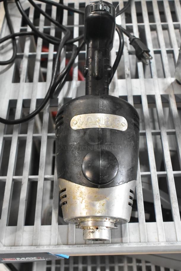 Waring WSB immersion blender base, 120V, 1 phase. Visible wear, model tag intact. Black and silver finish.