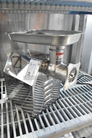 PrepLine MC12 metal commercial countertop meat grinder, 110 volts, 1 phase. Stainless steel, with visible warning labels.