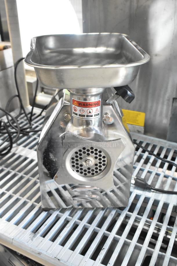PrepLine MC12 Metal Commercial Countertop Meat Grinder, 110 volts, 1 phase, stainless steel, warning labels visible.