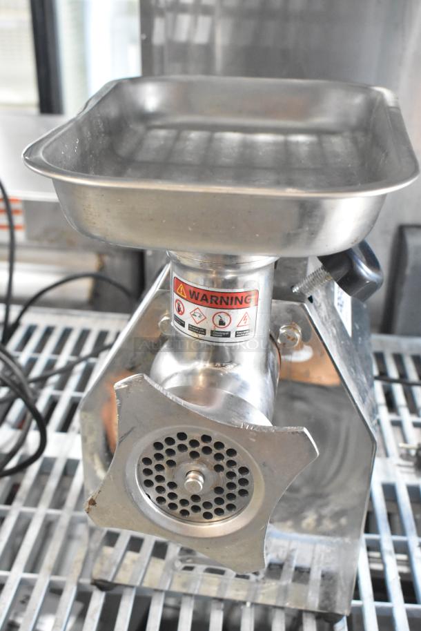 PrepLine MC12 commercial meat grinder, metal, countertop design, 110V, 1 phase. Warning labels visible on the body.