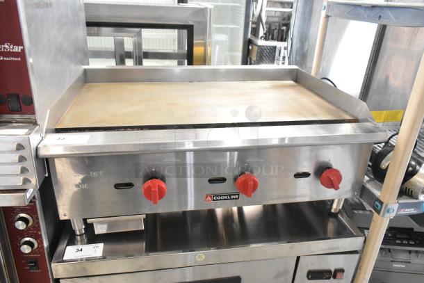 Cookline stainless steel gas flat top griddle, commercial countertop model, three red control knobs, excellent condition.