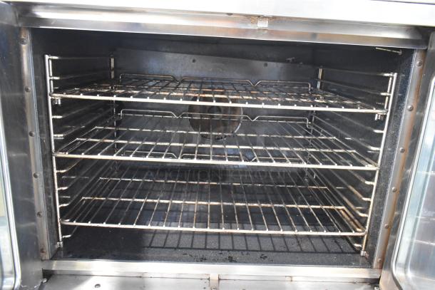 Southbend SilverStar stainless steel convection oven interior with metal racks and view-through doors, showing thermostatic controls.