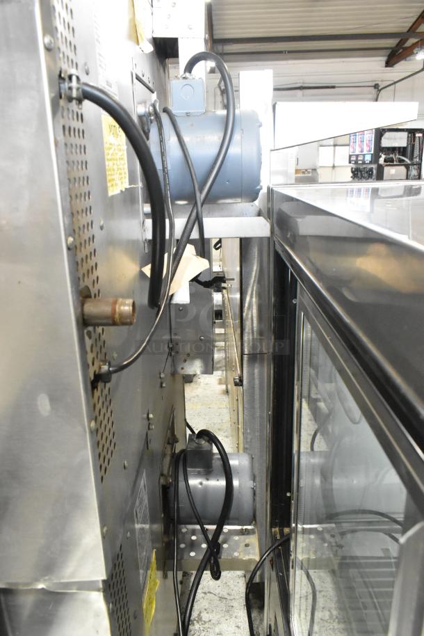 Southbend SilverStar stainless steel convection oven, gas-powered, featuring view-through doors and metal oven racks, on commercial casters.