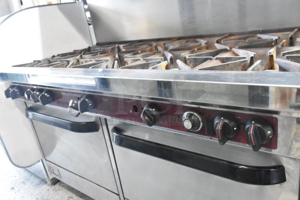 Southbend X460DD stainless steel commercial gas range with 10 burners, 2 ovens, over shelf, and backsplash. Good condition.