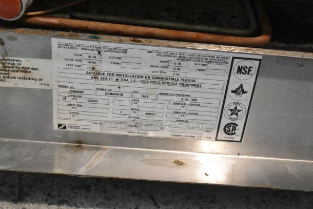 Southbend X460DD stainless steel commercial gas range with 10 burners, 2 ovens, over shelf, and backsplash, model tag visible.