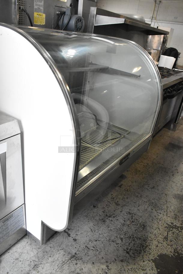 Leader Metal commercial deli display case, floor style, 115 volts, 1 phase, curved glass front, used condition.