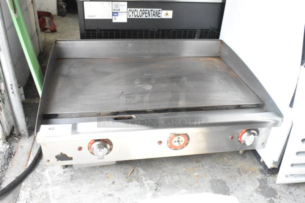Star stainless steel electric griddle, countertop model with thermostatic controls, visible wear, 208/240V, 1 phase.