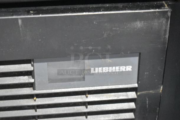 Liebherr commercial cooler, single door, metal finish, with poly coated racks. Operates on 115 volts, 1 phase.