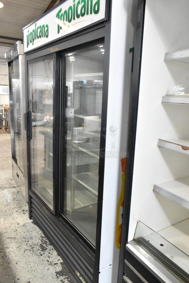 True GDM-45-LD commercial cooler with 2 glass doors, metal frame, Tropicana branding, poly-coated racks, 115V, 1 phase.