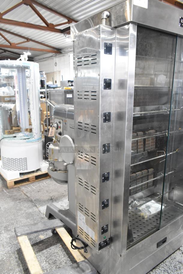 Southwood RG7 stainless steel rotisserie oven, 6 spit, natural gas, 114,000 BTU, on commercial casters, excellent condition.