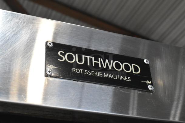Southwood RG7 stainless steel rotisserie oven, 6 spit, 114,000 BTU, natural gas, commercial casters, branded label visible.