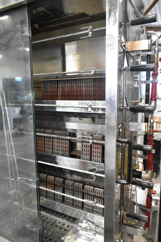 Southwood RG7 stainless steel rotisserie oven, natural gas, 6 spits, 114,000 BTU, commercial casters, excellent condition.
