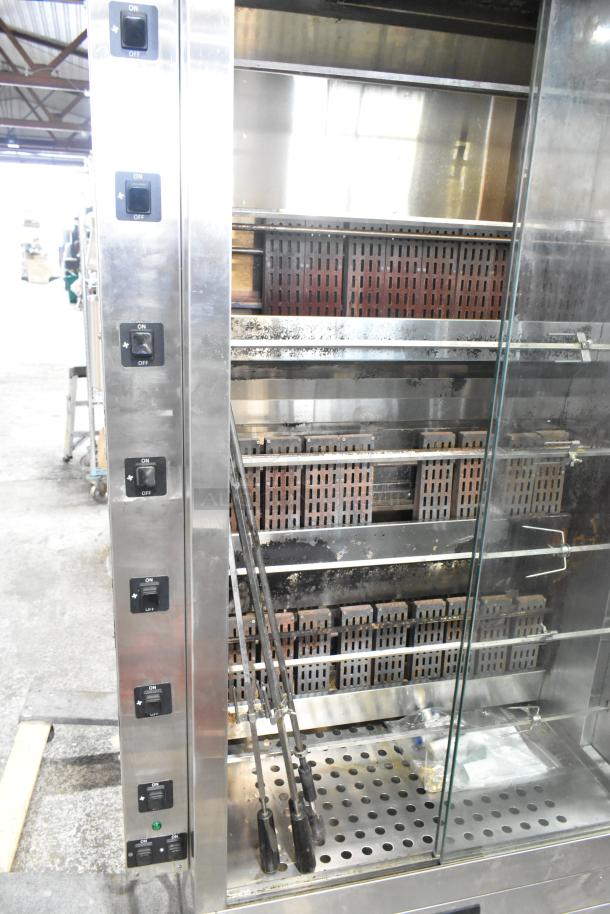 Southwood RG7 stainless steel rotisserie oven, natural gas, 6 spits, commercial casters, 114,000 BTU, visible controls.