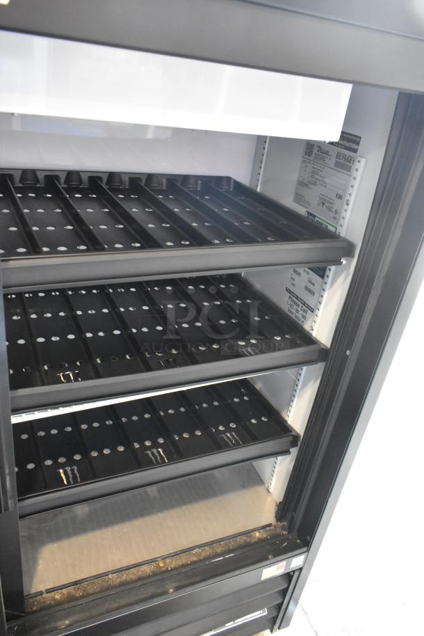 2019 True GDM-41SL-48-HC-LD 2-door reach-in cooler merchandiser, poly-coated racks, 115V, in good condition.