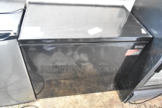 Frigidaire FGFRF7009-B-BLACK chest freezer, black, 115 volts, 1 phase, hinge lid, garage ready label, excellent condition.