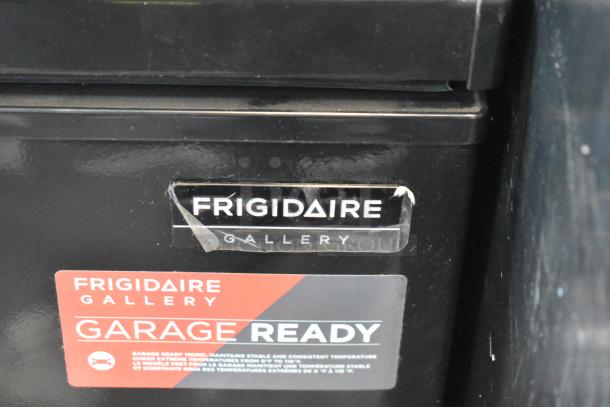 Frigidaire FGFRF7009-B-BLACK chest freezer, hinge lid, garage ready, 115V, 1 phase, black. Frigidaire Gallery label visible.