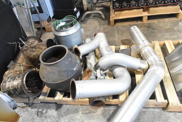 US Roaster Corp commercial gas-powered roaster/smoker parts. Includes metal exhaust pipes, connectors, and components on pallet.