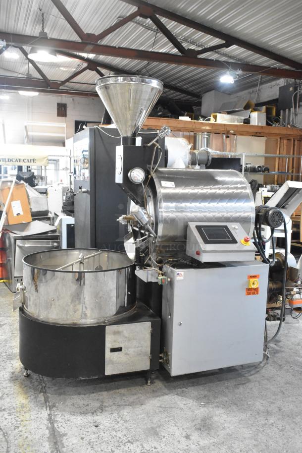 US Roaster Corp metal commercial roaster/smoker, natural gas powered, 208-230/460V, 3 phase, control panel, stainless steel finish.