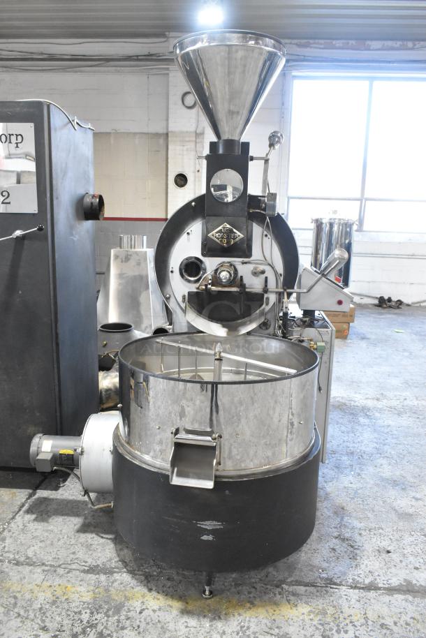 US Roaster Corp metal commercial roaster/smoker, natural gas powered, 208-230/460 volts, 3 phase, industrial setting.