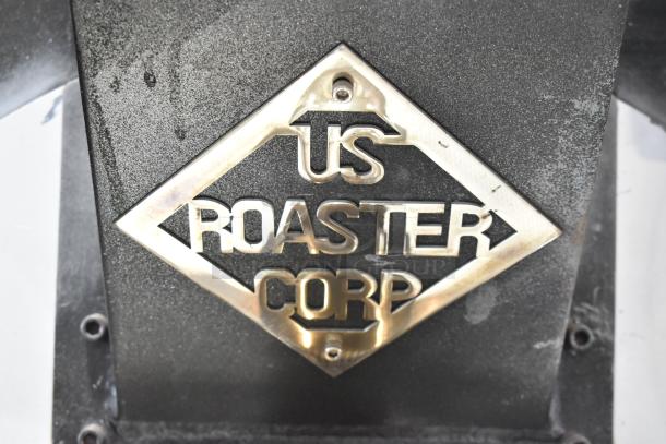 US Roaster Corp metal commercial roaster/smoker, natural gas powered, 208-230/460 volts, 3 phase, branded plaque visible.