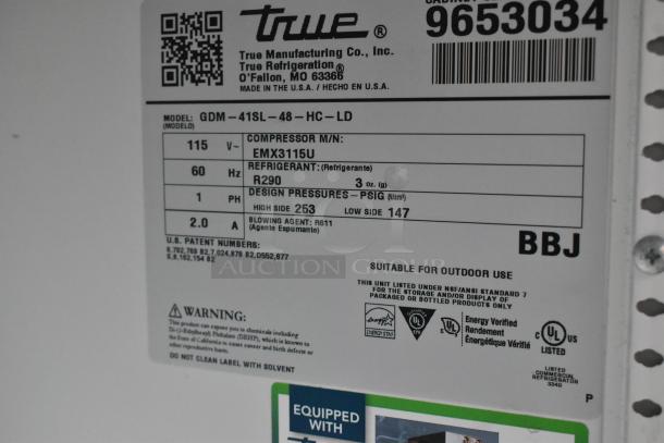 Label on 2019 True GDM-41SL-48-HC-LD Cooler, showing model, compressor info, refrigerant type, voltage, and certifications.