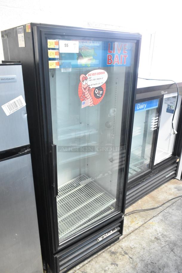 True GDM-12 metal commercial single door cooler with poly coated racks, glass front, good condition, 115 volts, 1 phase.