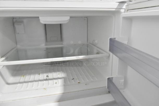 Whirlpool WRT511SZDW00 reach-in cooler freezer interior, glass shelf, storage space, slight wear, 115 volts, 1 phase.