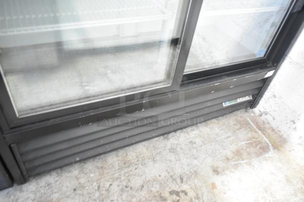 2019 True GDM-41SL-48-HC-LD 2-door reach-in cooler with poly-coated racks, visible exterior wear. 115V, 1 phase.
