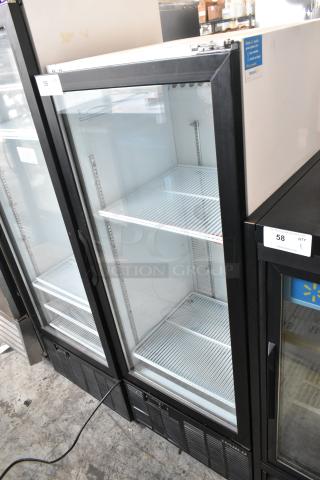 Habco SE12 metal commercial cooler; single door, poly coated racks, 115V, 1 phase; clear glass front; excellent condition.