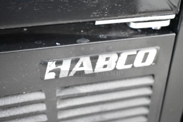 Habco SE12 metal single door cooler merchandiser, features poly-coated racks, 115 volts, 1 phase. Visible Habco logo.