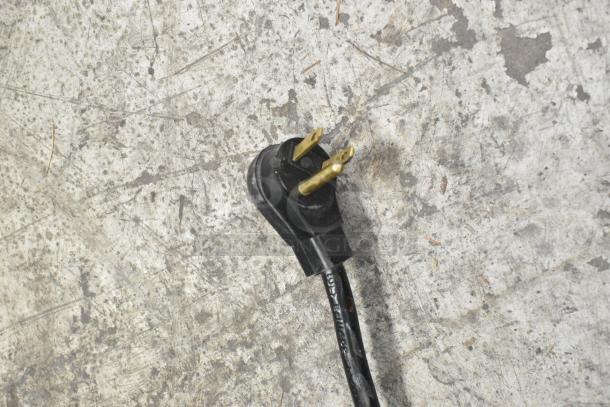 Black power plug for Habco SE12 commercial cooler, 115 volts, 1 phase, shown on a textured surface.