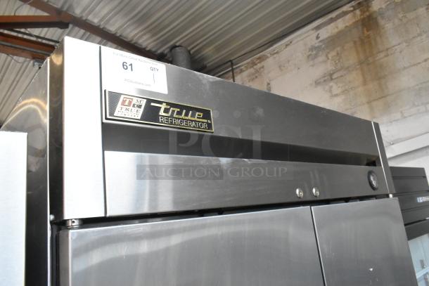 True T-35 stainless steel commercial 2-door reach-in cooler, poly-coated racks, on casters, 115V, 1 phase, model label visible.